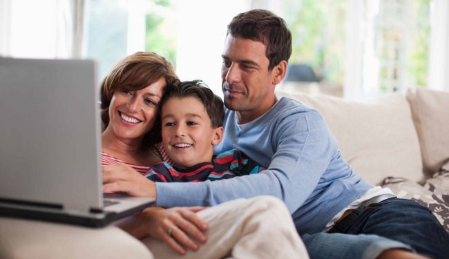 Family relaxing together on sofa