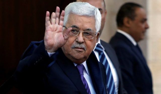 Palestinian President Mahmoud Abbas waves in Ramallah, in the occupied West Bank