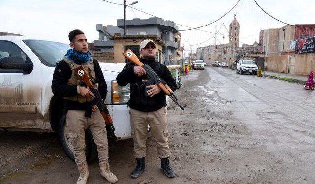 Iraqi Christians from Mosul attend a morning mass