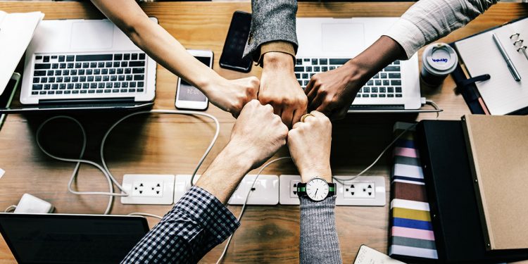 Colleagues giving a fist bump