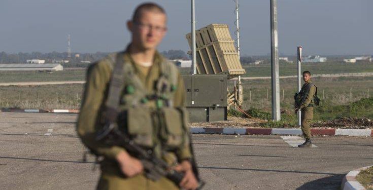 Israeli soldiers guard an Iron Dome air defense system deployed in the Israeli controlled Golan Heights near the border with Syria, Tuesday, Jan. 20, 2015. Israel has gone on high alert for possible attacks by Hezbollah, Israeli defense officials said Wednesday, beefing up its air defenses and increasing surveillance along its northern frontier following an airstrike in Syria that killed six members of the Lebanese militant group and an Iranian general.  The Israeli officials said that the "Iron Dome" anti-rocket defense system has been deployed near the Syrian and Lebanese borders as a precautionary measure. (AP Photo/Ariel Schalit)