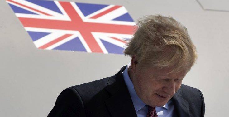 Britain's Prime Minister Boris Johnson arrives at the airport in Biarritz, France, for the first day of the G-7 summit, Saturday, Aug. 24, 2019. U.S. President Donald Trump and the six other leaders of the Group of Seven nations will begin meeting Saturday for three days in the southwestern French resort town of Biarritz. France holds the 2019 presidency of the G-7, which also includes Britain, Canada, Germany, Italy and Japan. (AP Photo/Peter Dejong)