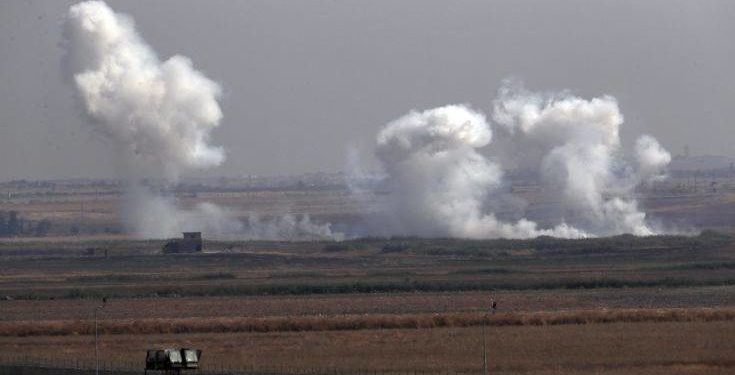 In this photo taken from the Turkish side of the border between Turkey and Syria, in Akcakale, Sanliurfa province, southeastern Turkey, smoke billows from targets inside Syria during bombardment by Turkish forces Thursday, Oct. 10, 2019. (AP Photo/Lefteris Pitarakis)