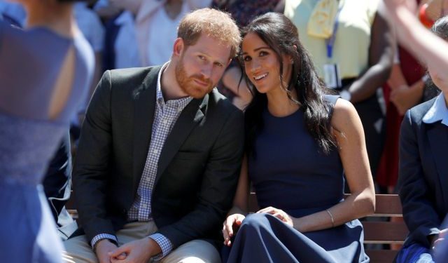 FILE PHOTO: Britain's Prince Harry and his wife Meghan, Duchess of Sussex, visit Macarthur Girls High School in Sydney
