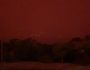 The sky is tinted red as surrounding bushfires close in on the town of Mallacoota, Victoria, Australia