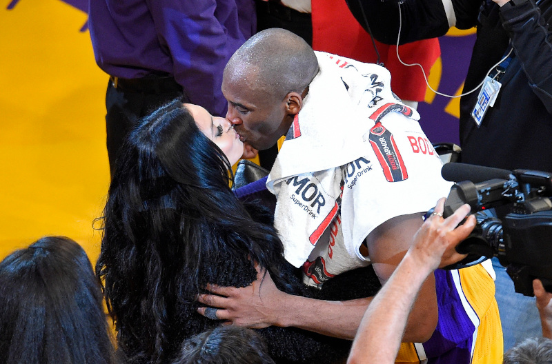 Los Angeles Lakers forward Kobe Bryant kisses his wife, Vanessa, after an NBA basketball game against the Utah Jazz, Wednesday, April 13, 2016, in Los Angeles. Bryant scored 60 points in what he said is his final NBA game as the Lakers won 101-96. (AP Photo/Mark J. Terrill)
