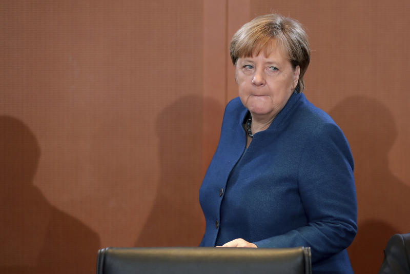 German Chancellor Angela Merkel arrives for the weekly cabinet meeting at the Chancellery in Berlin, Germany, Wednesday, Jan. 22, 2020. (AP Photo/Michael Sohn)