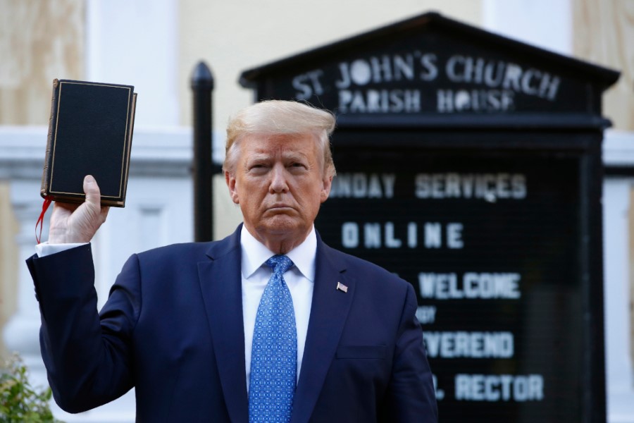 President Donald Trump holds a Bible as he visits outside St. John's Church across Lafayette Park from the White House Monday, June 1, 2020, in Washington. Part of the church was set on fire during protests on Sunday night. (AP Photo/Patrick Semansky)