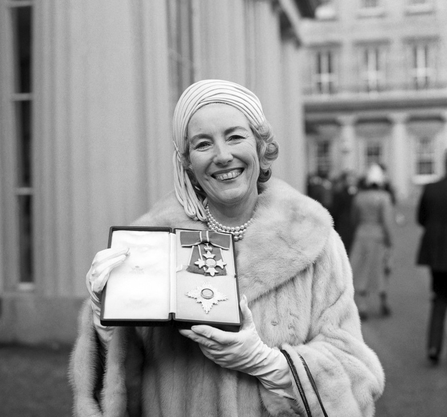 FILE  - In this Dec. 2, 1975 file photo, singer Vera Lynn poses outside Buckingham Palace after being invested a Dame Commander of the British Empire. The family of World War II forces sweetheart Vera Lynn says she has died. She was 103 it was reported on Thursday, June 18, 2020. (PA via AP, File)