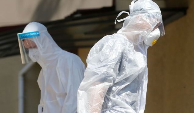 Medical workers walk outside the infectious disease ward at the Oleksandrivska Clinical Hospital in Kyiv