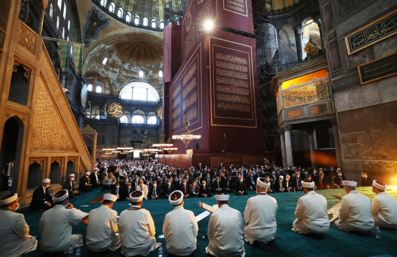 Imams read sermons as Friday as dignitaries including Turkey's President Recep Tayyip Erdogan take part in Friday prayers in Hagia Sophia, at the historic Sultanahmet district of Istanbul, Friday, July 24, 2020. Fulfilling a dream of his Islamic-oriented youth, Erdogan joined hundreds of worshipers for the first Muslim prayers in 86 years inside the Istanbul landmark that served as one of Christendom's most significant cathedrals, a mosque and a museum before its conversion back into a Muslim place of worship. The conversion of the edifice, has led to an international outcry. (Turkish Presidency via AP, Pool)