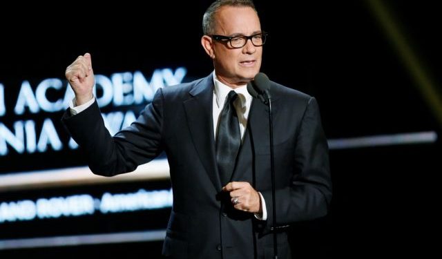 Actor Tom Hanks presents actress Felicity Jones the British Artist of the year award at the British Academy of Film and Television Arts (BAFTA) Los Angeles' Britannia Awards in Beverly Hills