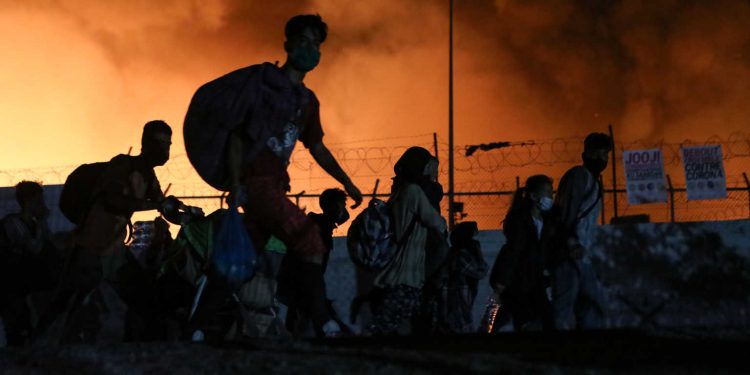 Fire burns at the Moria camp for refugees and migrants on the island of Lesbos