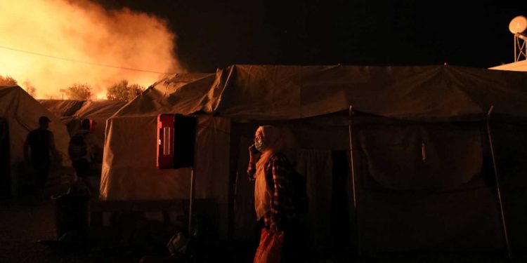 Flames rise as a fire burns at the Moria camp for refugees and migrants on the island of Lesbos