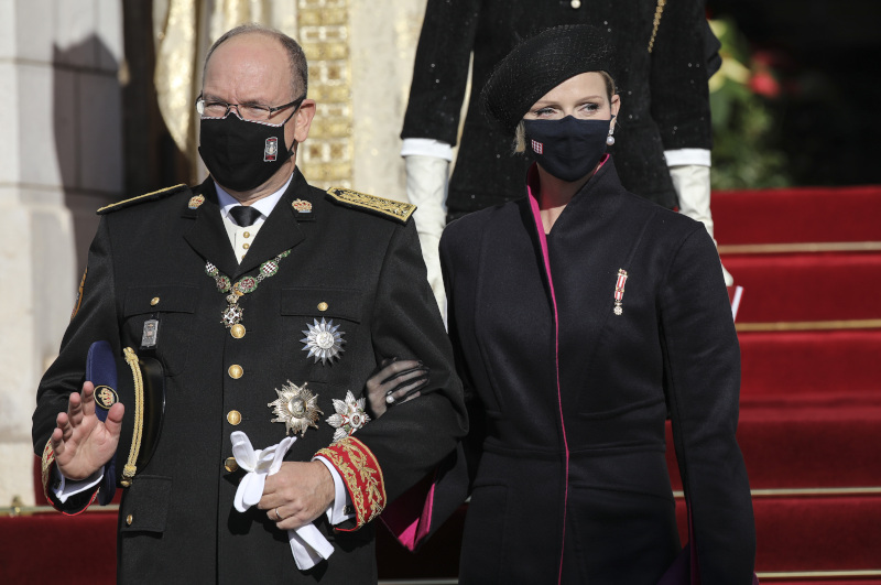 Prince Albert of Monaco, left, and Princess Charlene, depart the Monaco cathedral after ceremonies marking the National Day in Monaco, Thursday Nov. 19, 2020. (AP Photo/Daniel Cole)