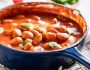 Hot baked beans with garlic and fresh tomatoes