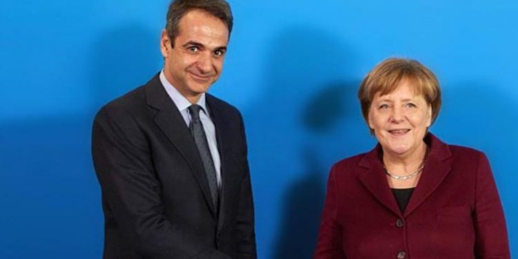 1472095-merkel-mitsotakis-930