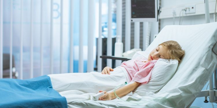 Cute Little Sick Girl Sleeps on a Bed in the Children's Hospital. Modern Pediatric Ward with Top Quality Health Care.