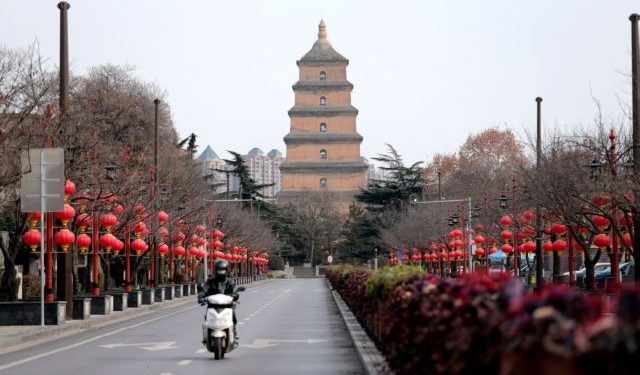 A rider travels on an empty road following lockdown measures to curb the spread of the coronavirus disease (COVID-19) in Xian, Shaanxi province, China December 26, 2021. Picture taken December 26, 2021. cnsphoto via REUTERS ATTENTION EDITORS - THIS IMAGE WAS PROVIDED BY A THIRD PARTY. CHINA OUT.