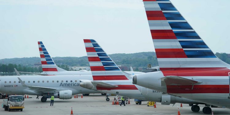 FILE PHOTO: American Airlines jets sit at gates at Washington's Reagan National airport in Washington