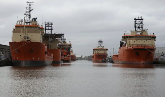 FILE PHOTO: Vessels that are used for towing oil rigs in the North Sea are moored up at William Wright docks in Hull