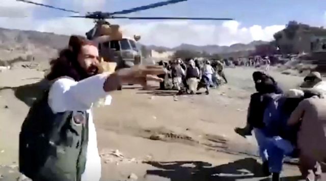 People carry injured to a helicopter following a massive earthquake, in Paktika Province, Afghanistan, June 22, 2022, in this screen grab taken from a video. BAKHTAR NEWS AGENCY/Handout via REUTERS THIS IMAGE HAS BEEN SUPPLIED BY A THIRD PARTY