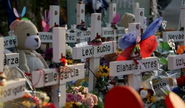 FILE PHOTO: Flowers, toys, and other objects to remember the victims of the deadliest U.S. school mass shooting resulting in the death of 19 children and two teachers, are seen at a memorial at Robb Elementary School in Uvalde, Texas, U.S. May 30, 2022. REUTERS/Veronica G. Cardenas/File Photo