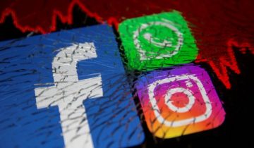 Facebook, Whatsapp and Instagram logos and stock graph are displayed through broken glass in this illustration taken October 4, 2021. REUTERS/Dado Ruvic/Illustration