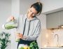 Young,Woman,Making,Detox,Smoothie,At,Home.,Woman,Pouring,Smoothie