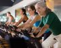 Portrait,Of,Confident,Adult,Woman,Training,On,Fitness,Bike,In