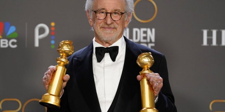 Steven Spielberg poses in the press room with the awards for best director, motion picture and for best motion picture, drama for "The Fabelmans" at the 80th annual Golden Globe Awards at the Beverly Hilton Hotel on Tuesday, Jan. 10, 2023, in Beverly Hills, Calif. (Photo by Chris Pizzello/Invision/AP)