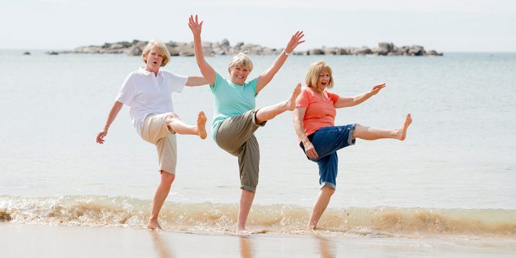 group of three senior mature retired women on their 60s having f