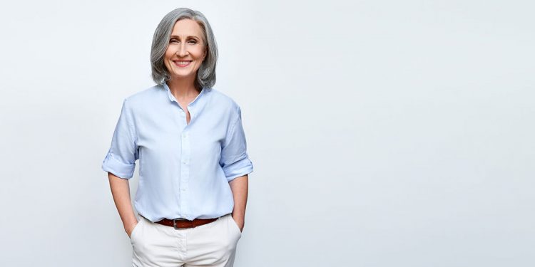 Smiling,Beautiful,Mature,Business,Woman,Standing,Isolated,On,White,Background.