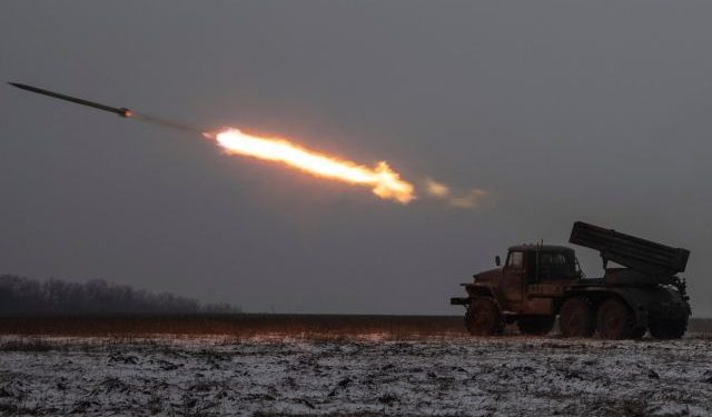 Ukrainian servicemen fire a BM-21 Grad multiple launch rocket system towards Russian positions on a frontline near the town of Bakhmut