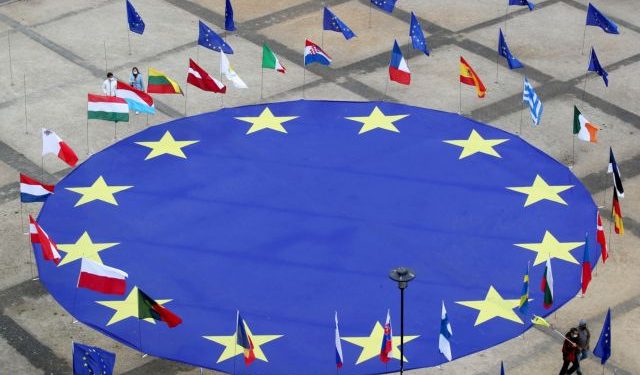 FILE PHOTO: A large European Union flag lies at the centre of Schuman Square outside European Commission headquarters in Brussels, Belgium, May 8, 2021.  REUTERS/Yves Herman/File Photo
