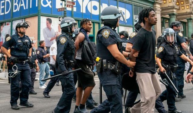 Police officers detain a person after popular live streamer Kai Cenat announced a "giveaway" event that grew chaotic, prompting police officers to respond and disperse the crowd at Union Square and the surrounding streets, in New York City, U.S. August 4, 2023.  REUTERS/David 'Dee' Delgado