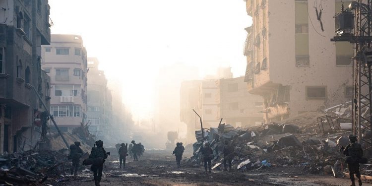 Israeli soldiers operate in the Gaza Strip, amid the ongoing ground operation of the Israeli army against the Palestinian Islamist group Hamas, in this handout image released November 20, 2023. Israel Defense Forces/Handout via REUTERS THIS IMAGE HAS BEEN SUPPLIED BY A THIRD PARTY