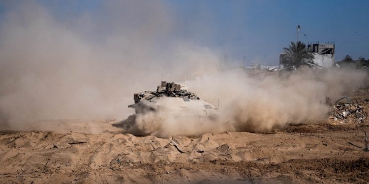 Israeli military vehicle manoeuvres during the ongoing ground operation of the Israeli army against Palestinian Islamist group Hamas, in the Gaza Strip as seen in a handout picture released by the Israel Defense Forces on November 13, 2023. Israel Defense Forces/Handout via REUTERS THIS IMAGE HAS BEEN SUPPLIED BY A THIRD PARTY TPX IMAGES OF THE DAY