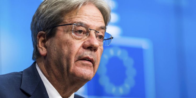 European Commissioner for Economy Paolo Gentiloni speaks during a media briefing after a meeting of eurogroup finance ministers at the European Council building in Brussels on Monday, Dec. 6, 2021. (AP Photo/Geert Vanden Wijngaert)