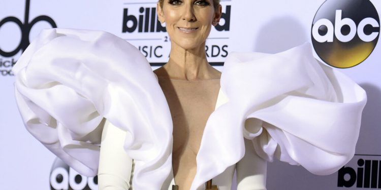 FILE - In this May 21, 2017 file photo, Celine Dion poses in the press room at the Billboard Music Awards in Las Vegas.  Dion has announced she will end her Las Vegas residency next year. The singer announced on social media Monday, Sept. 24, 2018, that she will leave Caesars Palace in June 2019. (Photo by Richard Shotwell/Invision/AP, File)