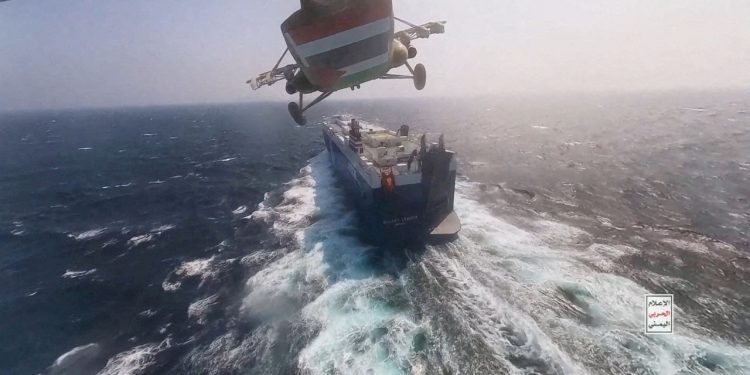 FILE PHOTO: Houthi military helicopter flies over the Galaxy Leader cargo ship in the Red Sea in this photo released November 20, 2023. Houthi Military Media/Handout via REUTERS    THIS IMAGE HAS BEEN SUPPLIED BY A THIRD PARTY/File Photo