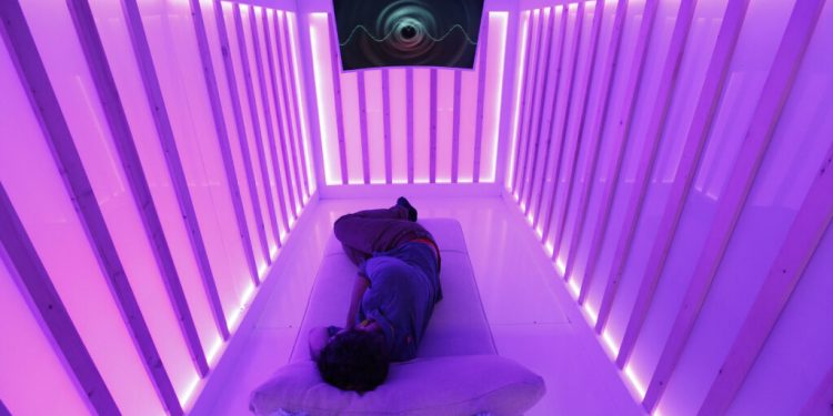 An attendee tests the Miku baby sleep and breathing monitor at the Miku booth at CES International, Wednesday, Jan. 9, 2019, in Las Vegas. (AP Photo/John Locher)