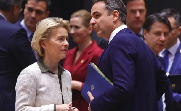 European Commission President Ursula von der Leyen, left, speaks with Greek Prime Minister Kyriakos Mitsotakis during a round table meeting at an EU summit in Brussels, Thursday, Feb. 20, 2020. After almost two years of sparring the EU will be discussing the bloc's budget, to work out Europe's spending plans for the next seven years. (AP Photo/Olivier Matthys)