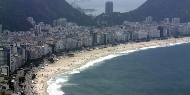 Copacabana beach is shown in this aerial view Friday, Oct. 9, 2015, in Rio de Janeiro. The 2016 Olympic Games will be held in Rio de Janeiro.  (AP Photo/David J. Phillip)