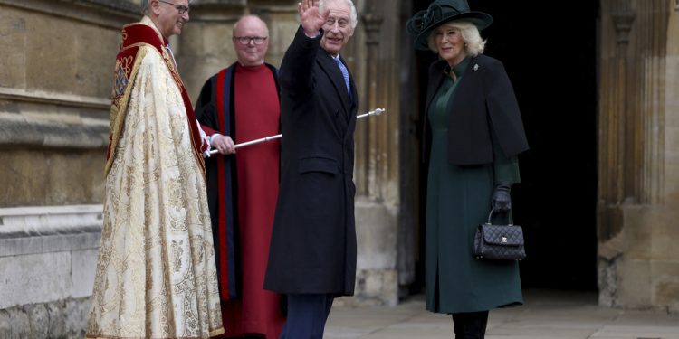 Britain's King Charles III, center, and Queen Camilla arrive to attend the Easter Matins Service at St. George's Chapel, Windsor Castle, England, Sunday, March 31, 2024. (Hollie Adams/Pool Photo via AP)
