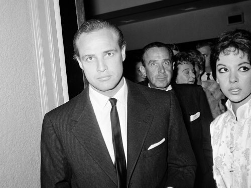 Actors Marlon Brando and Rita Moreno attend a charity show at the Huntington Hartford Theater in Hollywood, April 3, 1959. Others are unidentified. (AP Photo)