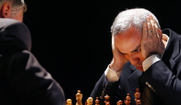 FILE - In this Tuesday, Sept. 22, 2009 file photo, former chess world champion Garry Kasparov, right, and Anatoly Karpov, left, play an exhibition rematch in Valencia, Spain. Kasparov is hoping to oust the head of the World Chess Federation in a bitter contest on the sidelines of an international tournament in Norway. Kasparov, a vocal critic of Russian President Vladimir Putin, is challenging Kirsan Ilyumzhinov, a wealthy businessman known to be supported by the Russian president. (AP Photo/Alberto Saiz, File)