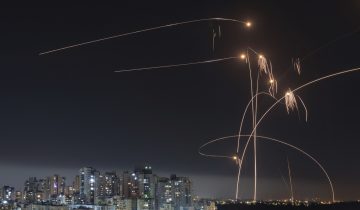 FILE - Israel's Iron Dome missile defense system fires interceptors at rockets launched from the Gaza Strip, in Ashkelon, southern Israel. Thursday, May 11, 2023. Since Russia invaded Ukraine in February 2022, more than 45,000 Ukrainians have sought refuge in Israel. Then, Israel's war erupted. Now many are reliving their trauma. Some have left Israel, but many remain — refusing to again flee a war. (AP Photo/Tsafrir Abayov, File)