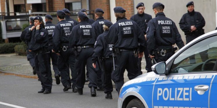 Police patrol in Alsdorf, near Aachen, western Germany, Tuesday, Nov. 17, 2015. German police have arrested three people in Alsdorf near Aachen in connection with the Paris attacks, the dpa news agency reported Tuesday. (AP Photo/Hermann J. Knippertz)