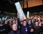 CDU supporters celebrate top candidate for chancellor Friedrich Merz at the main election campaign event of the Christian Democratic Union, Friday, Feb. 21, 2025, in Oberhausen, Germany, ahead of Sunday's German federal Bundestag elections. (AP Photo/Martin Meissner)